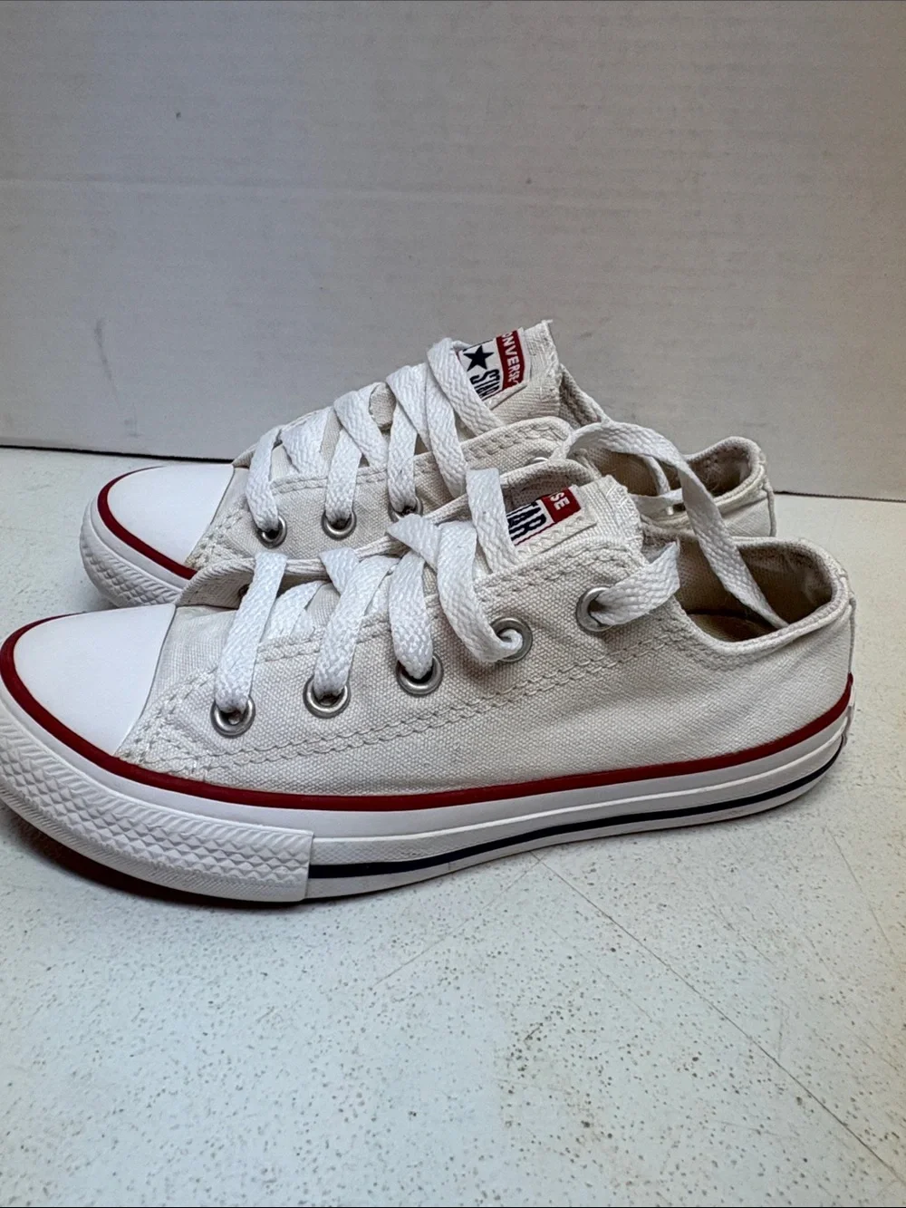 Converse White Low-Top Sneakers with Red Stripe
